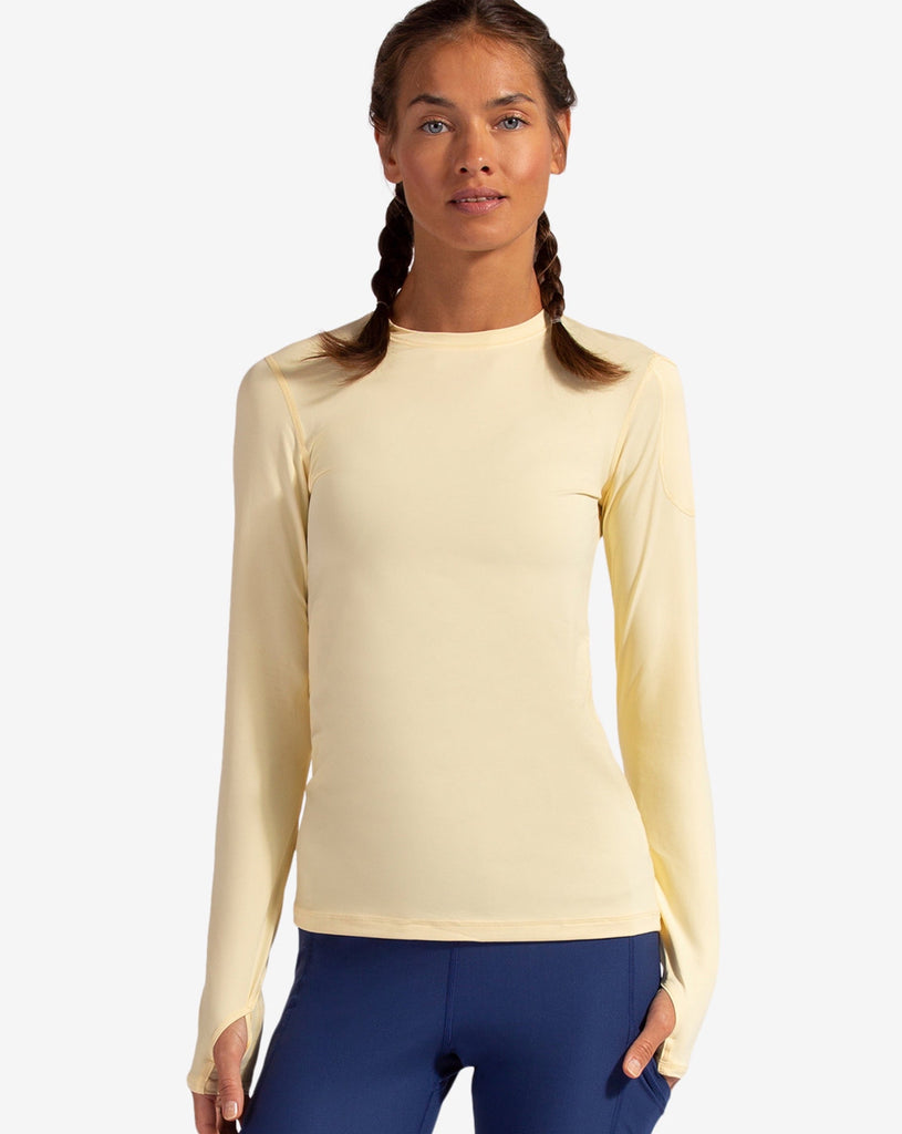 Women wearing lemon yellow long sleeve 24/7 shirt with navy tights. (Style 2001) - BloqUV