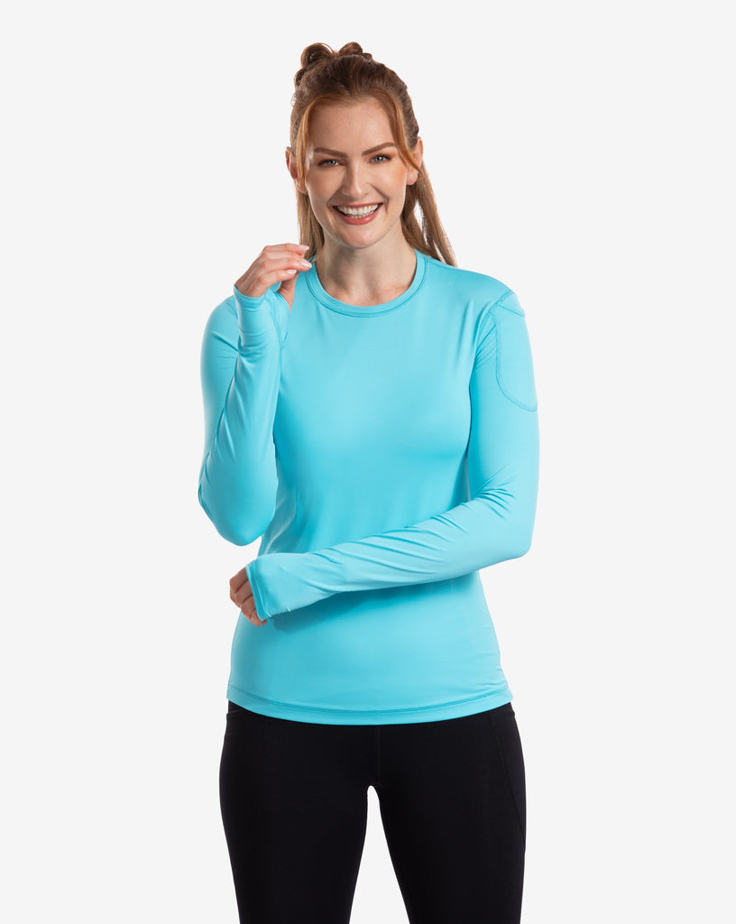 Women wearing light turquoise blue long sleeve 24/7 shirt with black tights. (Style 2001) - BloqUV