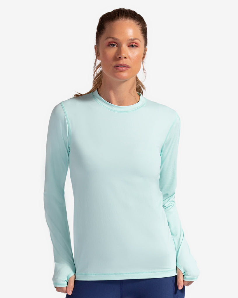 Women wearing mint long sleeve 24/7 shirt with navy tights. (Style 2001) - BloqUV