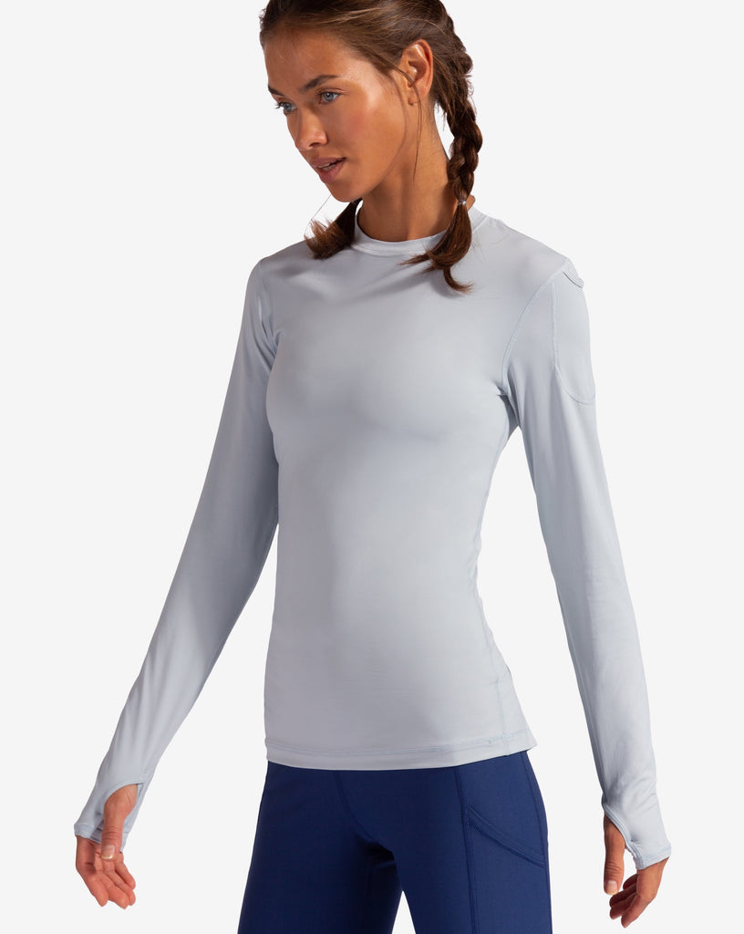 Women wearing soft grey long sleeve 24/7 shirt with navy leggings. (Style 2001) - BloqUV