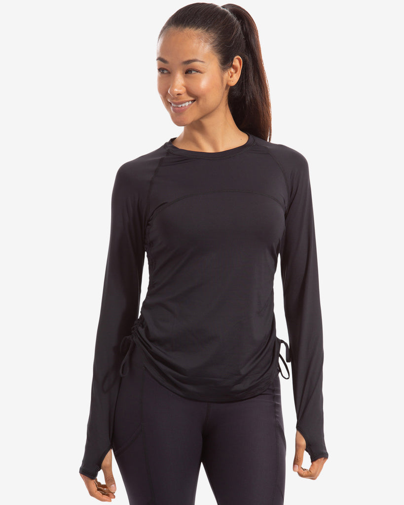 Women wearing black long sleeve drawstring crew with black tights. (Style 2006) - BloqUV