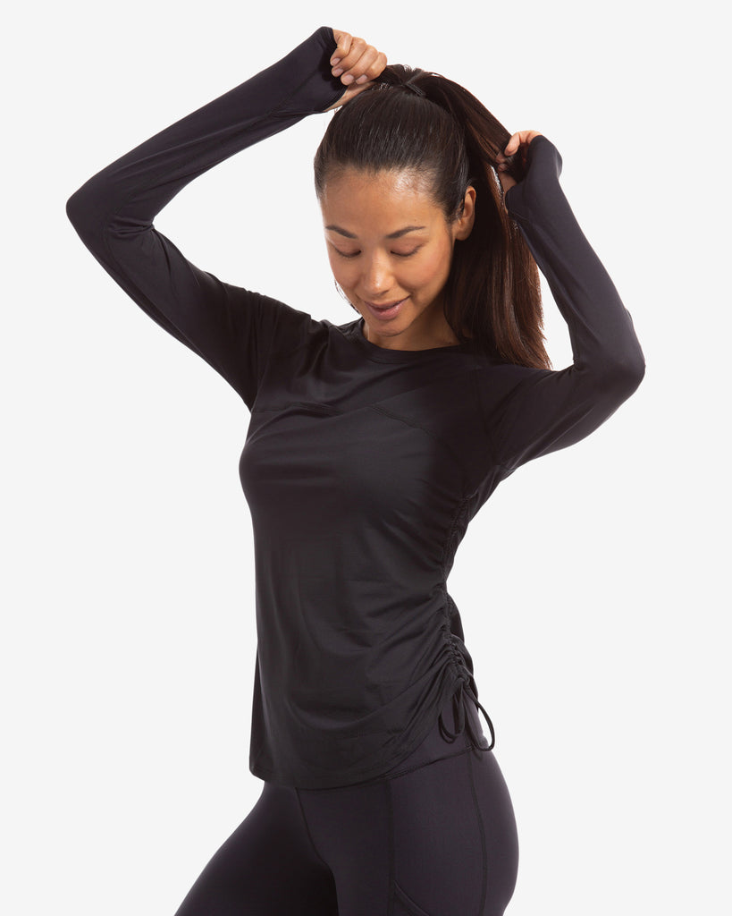 Women wearing black long sleeve drawstring crew with black tights. (Style 2006) - BloqUV