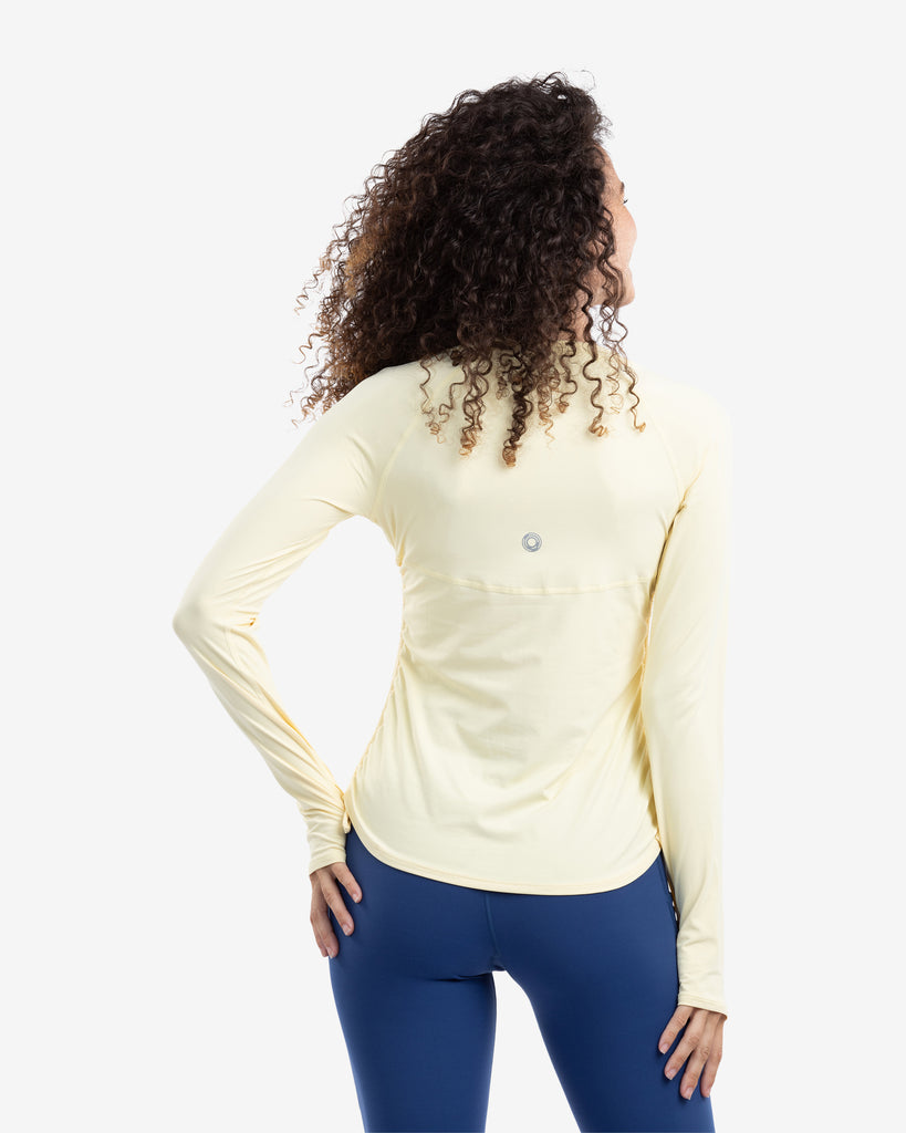 Women wearing lemon yellow long sleeve drawstring crew with navy tights. Picture shows back of shirt. (Style 2006) - BloqUV