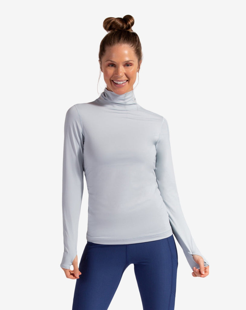 Women wearing soft grey turtle neck top with navy tights. (Style 2013) - BloqUV