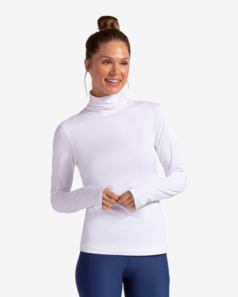 Women wearing white turtle neck top with navy tights. (Style 2013) - BloqUV