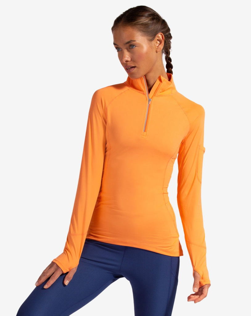 Women wearing tangerine mock zip long sleeve top with navy tights. (Style 3001) - BloqUV