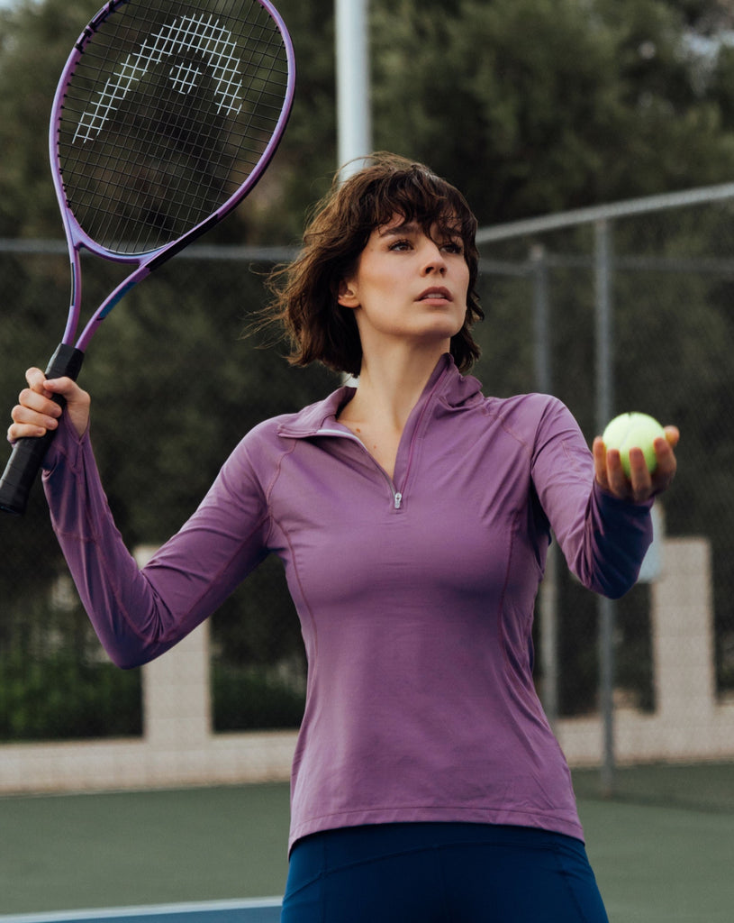 Women playing tennis wearing plum top with navy tights. (Style 3001) - BloqUV