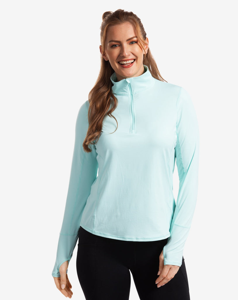 Women wearing mint relaxed mock zip top with black tights. (Style 3002) - BloqUV