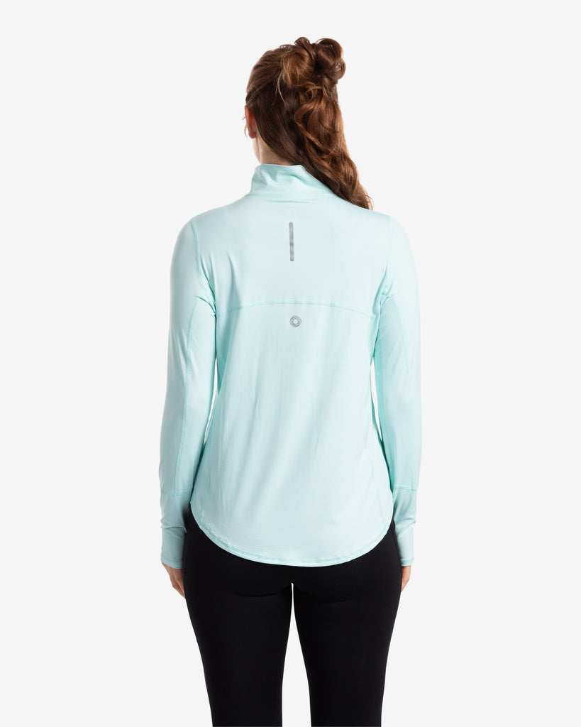 Women wearing mint relaxed mock zip top with black tights. Pictures shows back of shirt. (Style 3002) - BloqUV