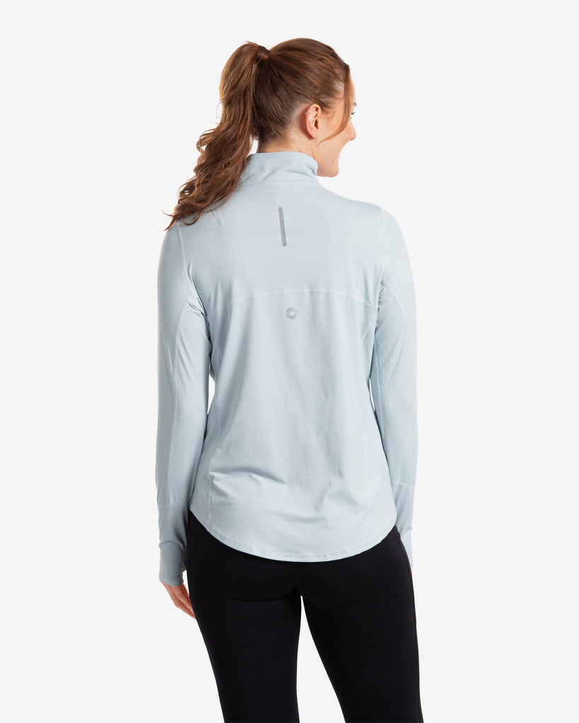 Women wearing soft grey relaxed mock zip top with black tights. Picture shows back of shirt. (Style 3002) - BloqUV