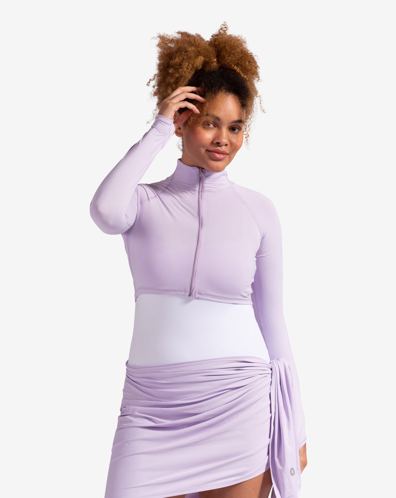 Women wearing lavender full zip crop top with one piece swimsuit and lavender blanket as as skirt.(Style 4010) - BloqUV