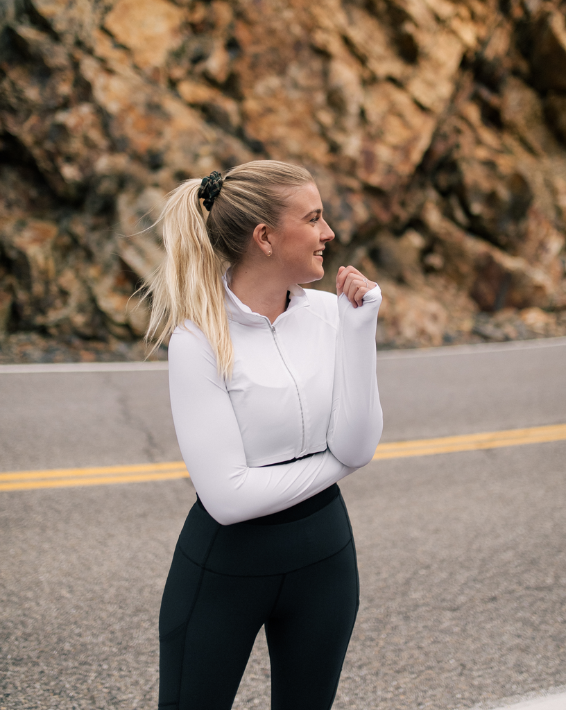 Women walking in the road wearing white turquoise full zip crop top over tank top with black leggings. (Style 4010) - BloqUV