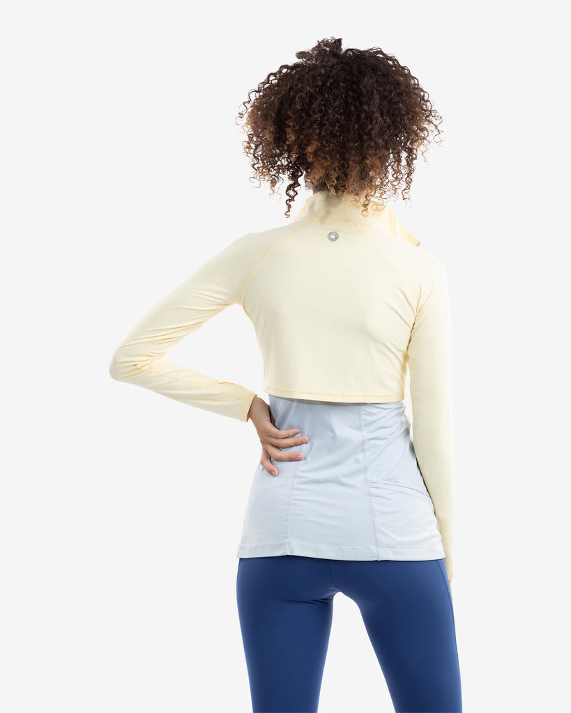 Women wearing lemon yellow full zip crop top over tank top with leggings. Picture shows the back of the shirt. (Style 4010) - BloqUV