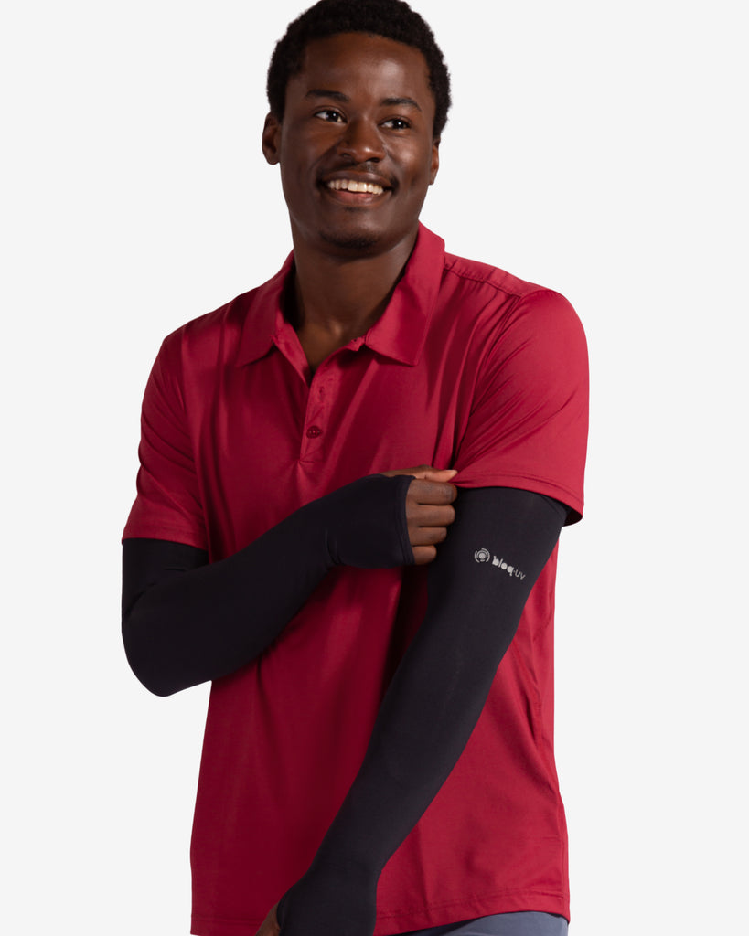 Man wearing black color unisex sleeves with short sleeve red polo shirt. (Style 5005) - BloqUV