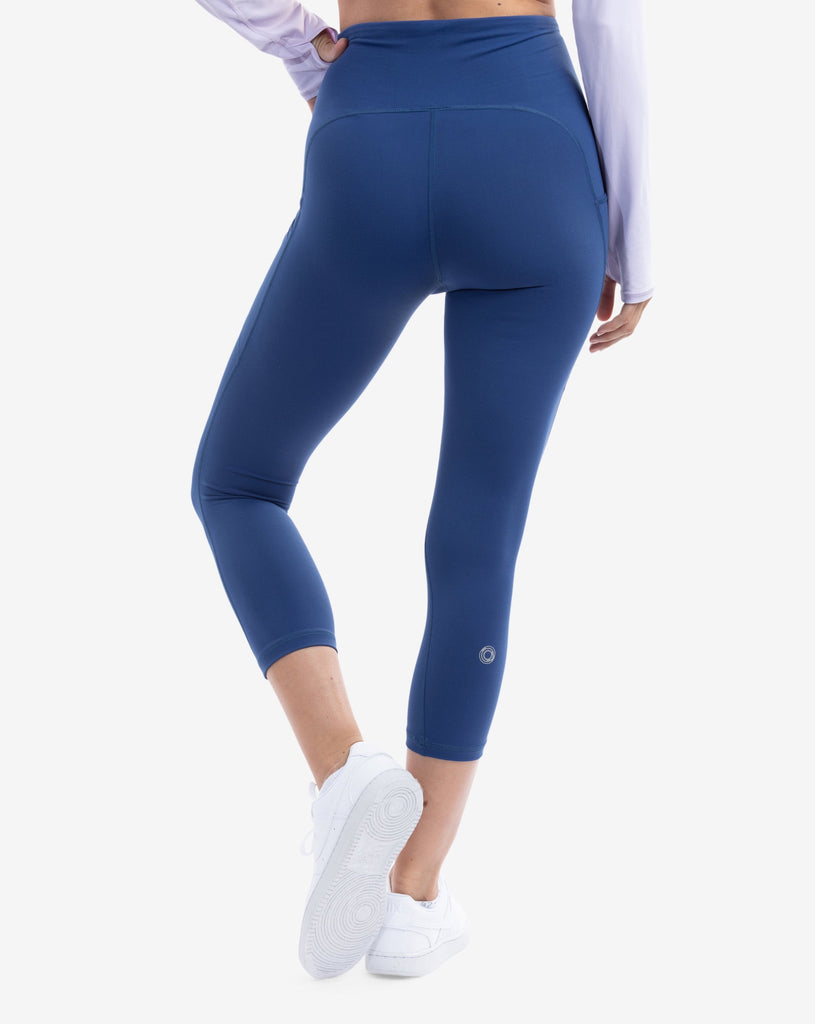 Women wearing compression capri leggings in navy. Back view shown. (Style 6103) -BloqUV