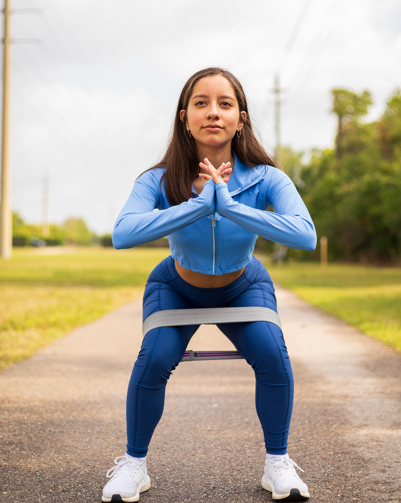 Women exercising wearing indigo full zip crop top with navy leggings.  (Style 4010) - BloqUV