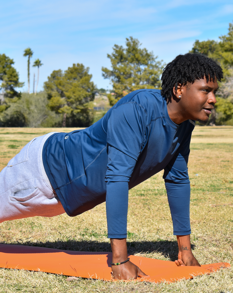 Man doing push ups outdoors wearing long sleeve jet tee shirt in navy blue. (Style 12002) - BloqUV